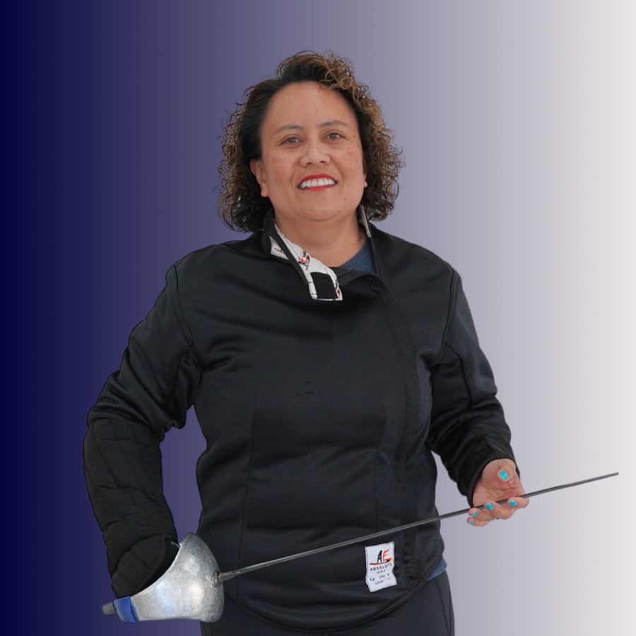 A woman smiling and holding a fencing sword, dressed in a black fencing jacket against a gradient background.