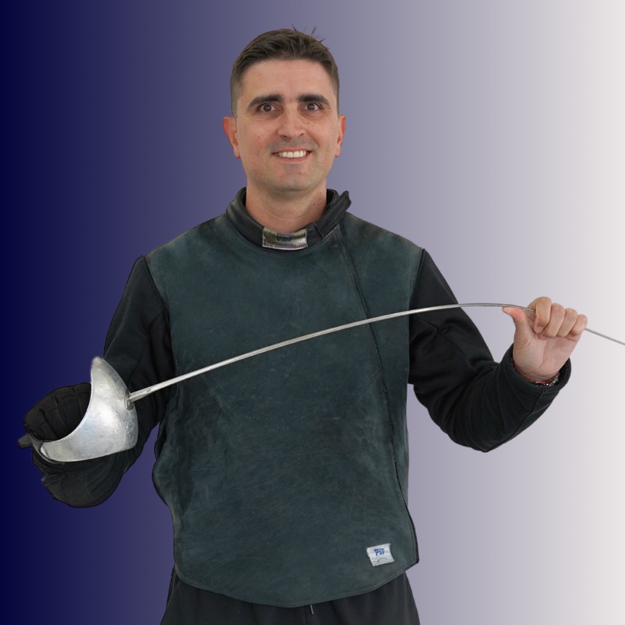 A man in a fencing suit holding a fencing sword in front of a gradient blue background.